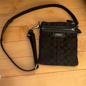 Small black coach bag. Perfect for everyday on the go 2 big pockets.